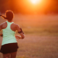 Woman running at sunset