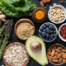 A spread of healthy veggies, fruits, nuts, grains, and spices