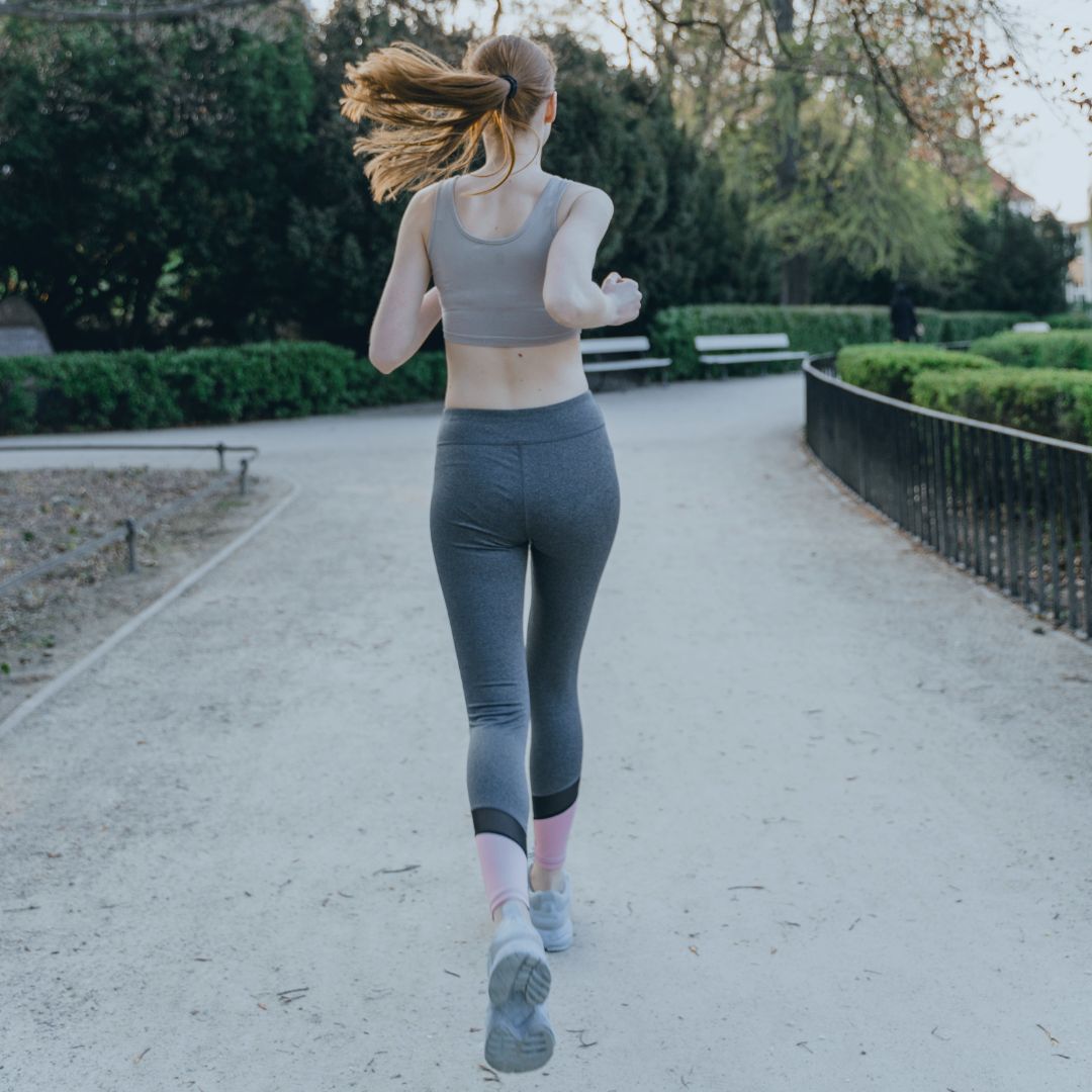 Fit woman running in a park