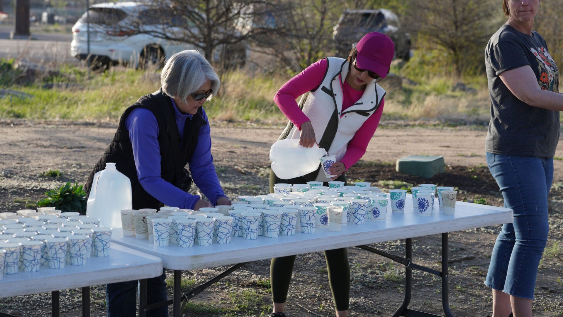 Volunteers setting up bottled waters for aid stations